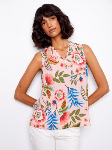 Floral blouse with a V-neck, showcasing a vibrant pattern of pink and blue flowers. Perfect for summer outings by Charlie B.