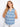 This stylish top features a V-neck design, adding an elegant touch to its intricate blue and white pattern. By Charlie B.
