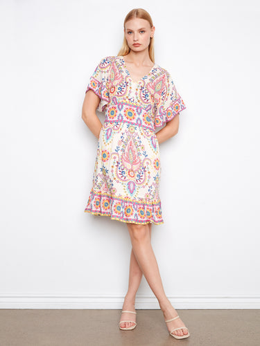 Delightful dress showcasing flutter sleeves with vibrant patterns and a smocked back waist by Charlie B.