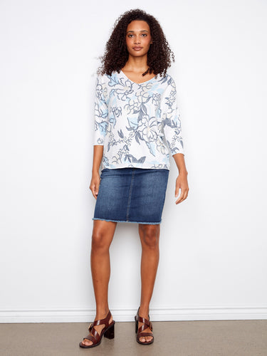 Stylish top featuring a placement print design and comfortable 3/4 sleeves for versatile wear. By Charlie B.