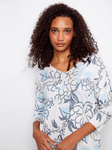 Chic V-neck top with exquisite placement print, offering both style and comfort in every detail. By Charlie B.