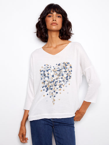 Elegant white top with heart-shaped floral design, featuring a placement print and 3/4 sleeves by Charlie B.