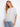 Striped dolman top with a boat neckline and sunny embroidery, featuring a side tie by Charlie B.