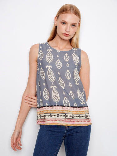 Top with a blue mural graphic print, showcasing a sleeveless design and intricate border detail by Charlie B.
