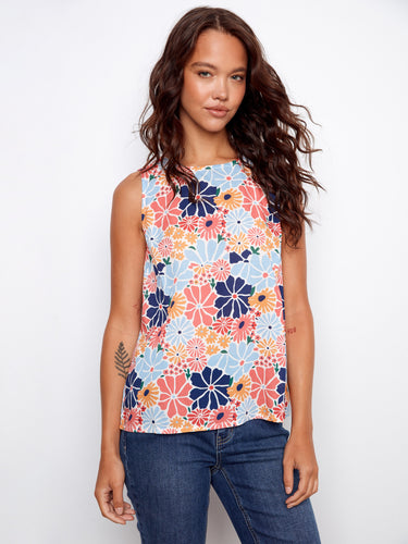 Floral top featuring a crew neckline and vibrant colors, perfect for a casual day out. Designed by Charlie B.