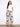 Floral pants with a self belt tie, offering a chic and adjustable fit. Perfect for any occasion. By Charlie B.
