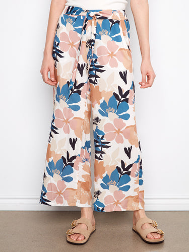 These cropped length pants feature vibrant floral patterns, adding a playful touch to your wardrobe. By Charlie B.