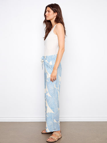 Regular rise wide-leg pants adorned with an elegant floral pattern and tie front detail by Charlie B.