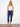 Denim pants with a slim leg silhouette, featuring a chic bow detail at the hem for added style by Charlie B.