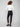 Sophisticated black pants with slit detail at the hem, complemented by a white top for modern flair by Charlie B.