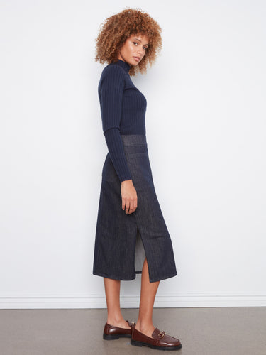Crafted in stretch denim, this midi skirt offers ease of movement while maintaining a chic silhouette by Charlie B.