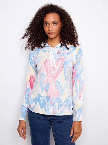Vibrant hoodie featuring a stunning reverse print design, crafted from soft fabric for ultimate comfort by Charlie B.