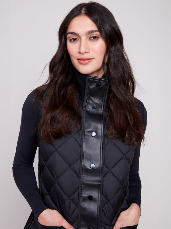 Sophisticated black quilted vest with sleek button detailing, perfect for versatile styling by Charlie B.