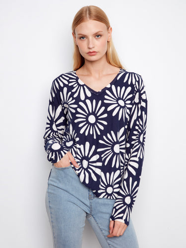 Floral graphic sweater in navy blue and white, showcasing long sleeves. Crafted for style and comfort by Charlie B.