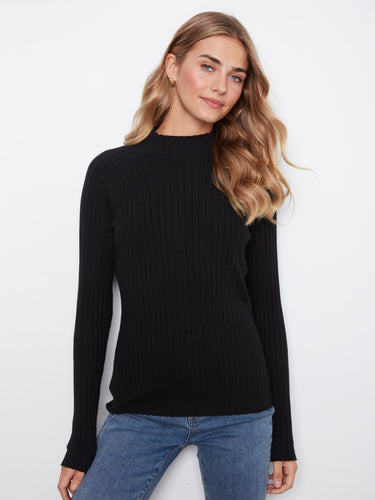 Black ribbed knit sweater featuring a sleek slim fit design, perfect for layering by Charlie B.