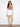White skort featuring a chic scalloped hem and convenient front pockets, made from stretch twill fabric by Charlie B.