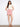 Pink skirt with front buttons and scalloped hem, featuring built-in shorts for added comfort by Charlie B.