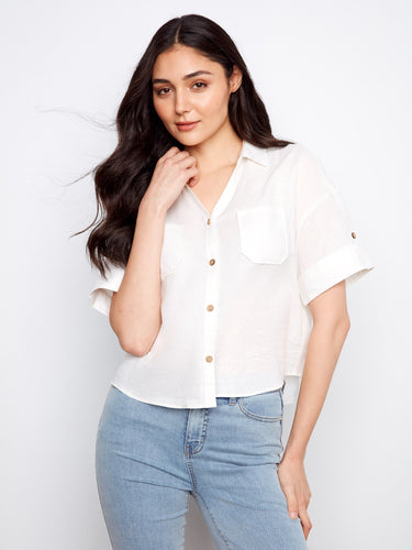 White shirt with a classic collar and chest pockets, perfect for casual outings. Crafted from a comfortable fabric by Charlie B.
