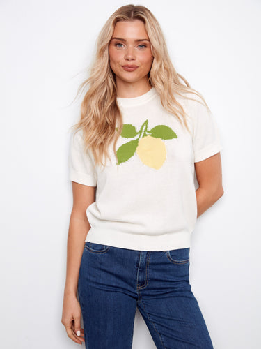 White cotton sweater with a lemon design, featuring a classic crew neckline for a timeless look. By Charlie B.
