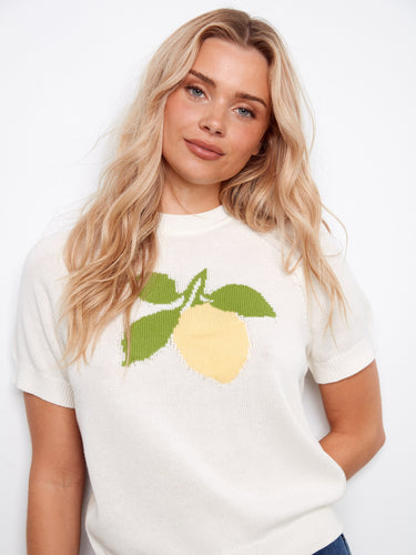 Stylish short raglan sleeves enhance this 100% cotton sweater with a charming lemon motif. By Charlie B.