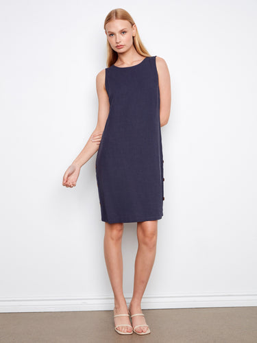 Navy sleeveless shift dress featuring a straight silhouette and decorative buttons on the side by Charlie B.