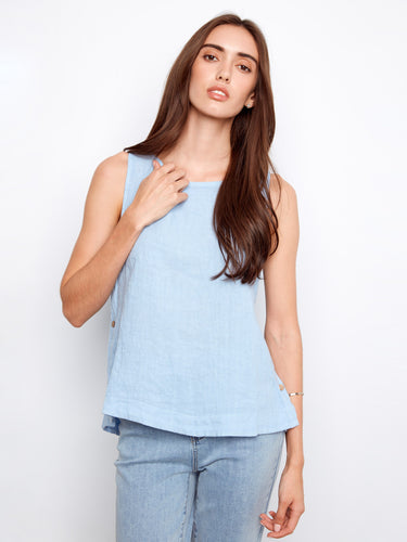 Light blue sleeveless top featuring a scoop neckline, perfect for warm weather. Crafted with elegance and comfort by Charlie B.