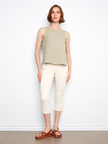Chic and versatile, this linen top highlights its unique side button detailing for added flair by Charlie B.