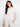 Subtle blanket stitch detailing elevates this piece with an understated charm that complements its cozy design by Charlie B.