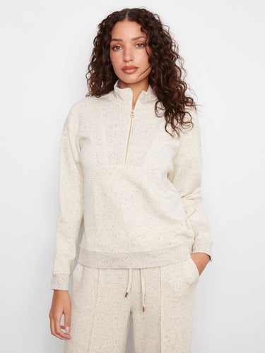This soft scuba fabric top features a half-zip mock neck for versatile styling. Perfect for layering in any season. By Charlie B.
