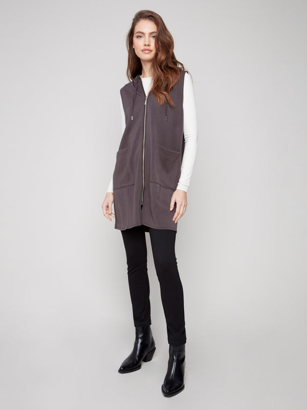 Mocha vest with mid-thigh length, featuring a zip front and practical patch pockets for a stylish look by Charlie B.