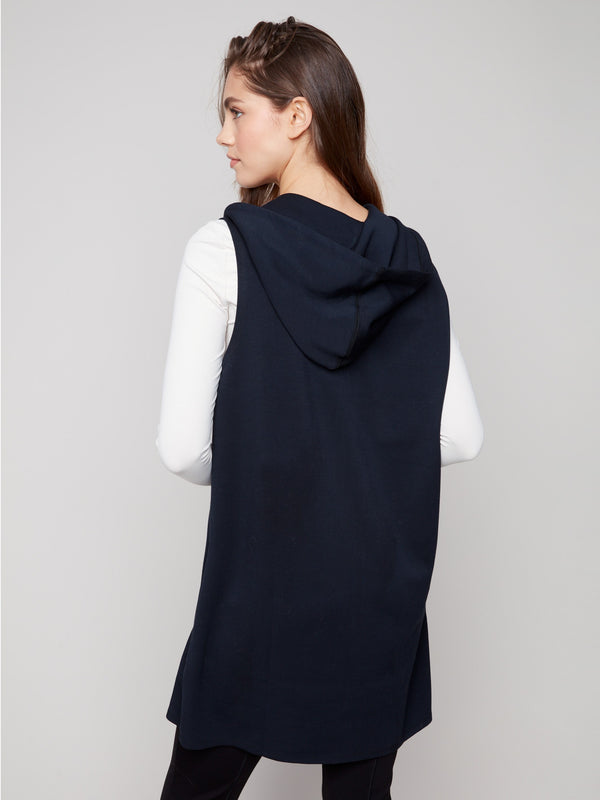 Versatile long black vest showcasing a stylish design with an attached hood, great for layering by Charlie B.