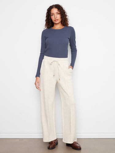 These pants feature a wide leg design, offering a relaxed and comfortable fit for any occasion by Charlie B.