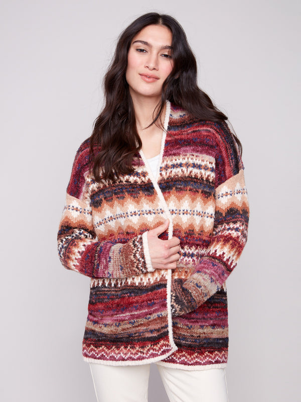 Colorful Space Dye Jacquard Cardigan with side seams pockets, crafted in jewel tones and a geometric motif by Charlie B.