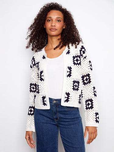 White crochet cardigan with a stylish crew neck and geometric patterns, perfect for layering by Charlie B.