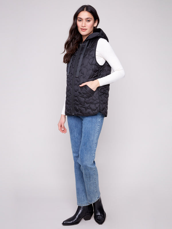 Stylish vest with a zipper front closure and star quilting, perfect for layering by Charlie B.