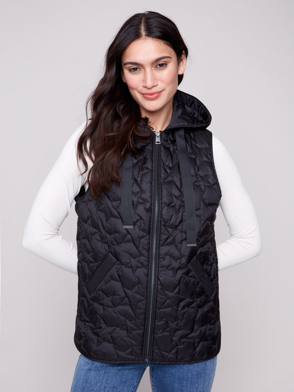 Quilted black vest with welt pockets, offering both style and functionality by Charlie B.