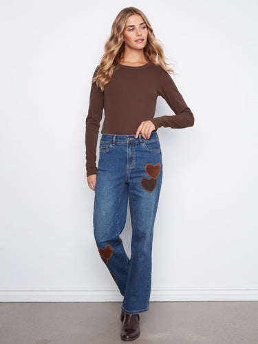 Regular rise jeans with eye-catching corduroy heart patches bring a unique flair to classic denim. Comfortable fit by Charlie B.