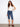 Woman in indigo pedal pushers with a regular rise, featuring a cuffed hem for added style by Charlie B.