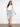 Light blue denim skirt with a regular rise, featuring five practical pockets for convenience. Designed by Charlie B.