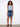 Denim skirt featuring a regular rise for comfortable wear, paired with a sleeveless top. Finished with frayed edges. By Charlie B.