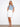 White skort with regular rise, frayed hem, and button closure, offering a stylish look by Charlie B.