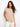 Sand-colored striped knit top with a drop cap sleeve design, ideal for a casual look by Charlie B.