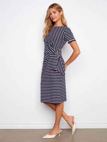 Stylish navy striped dress featuring cuffed sleeves for a polished look, worn by a model by Charlie B.