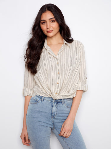 Striped shirt with a classic collar, featuring a stylish button-front closure for versatile wear. Designed by Charlie B.