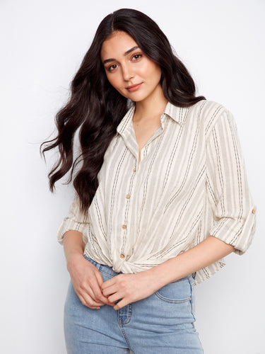 Elegant shirt with roll-up sleeves and button tab, offering both style and practicality for any occasion. Crafted by Charlie B.
