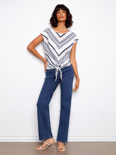 This stylish top features a front hem tie, adding a playful touch to your outfit. Made entirely from cotton by Charlie B.