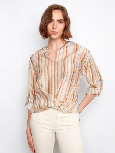 Elegant blouse with a twist front, featuring a unique striped pattern that adds sophistication to any look. Designed by Charlie B.