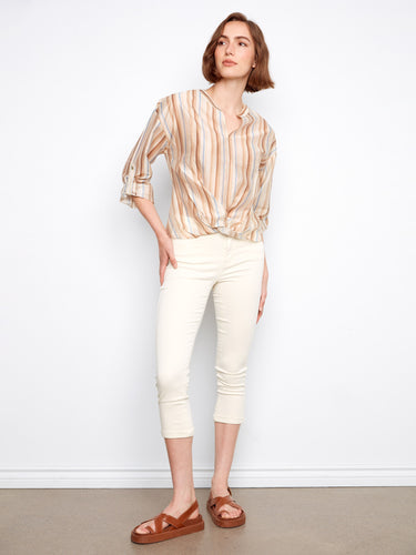 Chic striped blouse with roll-up sleeves for a versatile style. Perfect for casual or professional settings. By Charlie B.