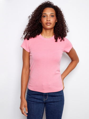 Pink ribbed texture t-shirt featuring a classic crew neck design, perfect for casual outings. By Charlie B.