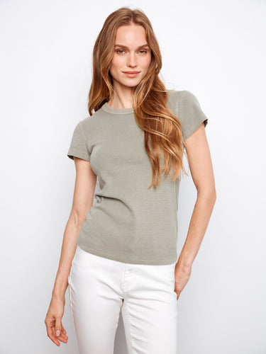 The semi-fitted cut of this top flatters the figure, making it a versatile choice for any wardrobe essential by Charlie B.